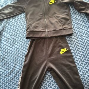 Nike Black Tracksuit with Bright Yellow Logo